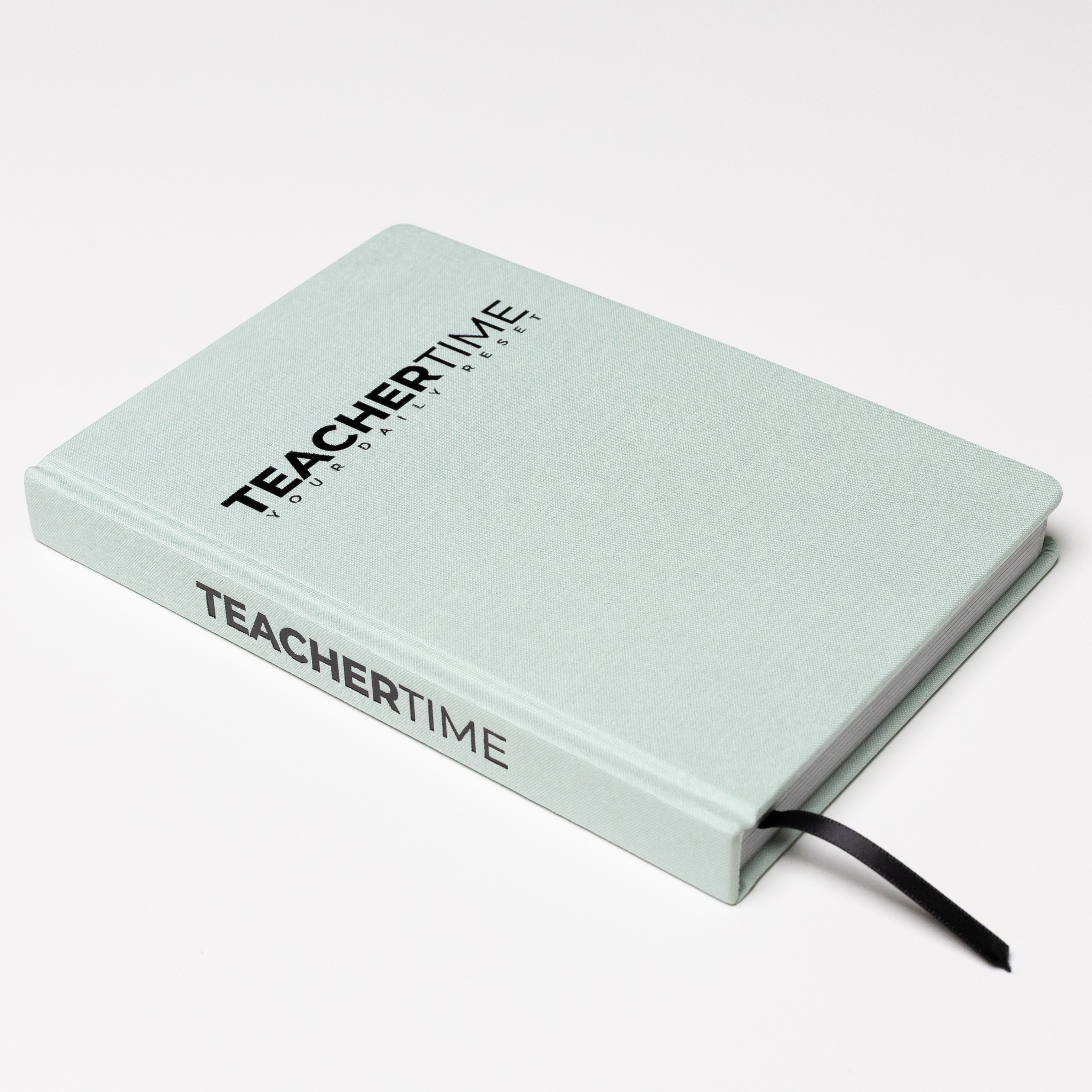 A light mint green hardcover notebook with 'TEACHERTIME' printed in black on the cover and spine, featuring a black ribbon bookmark, set against a clean white background.