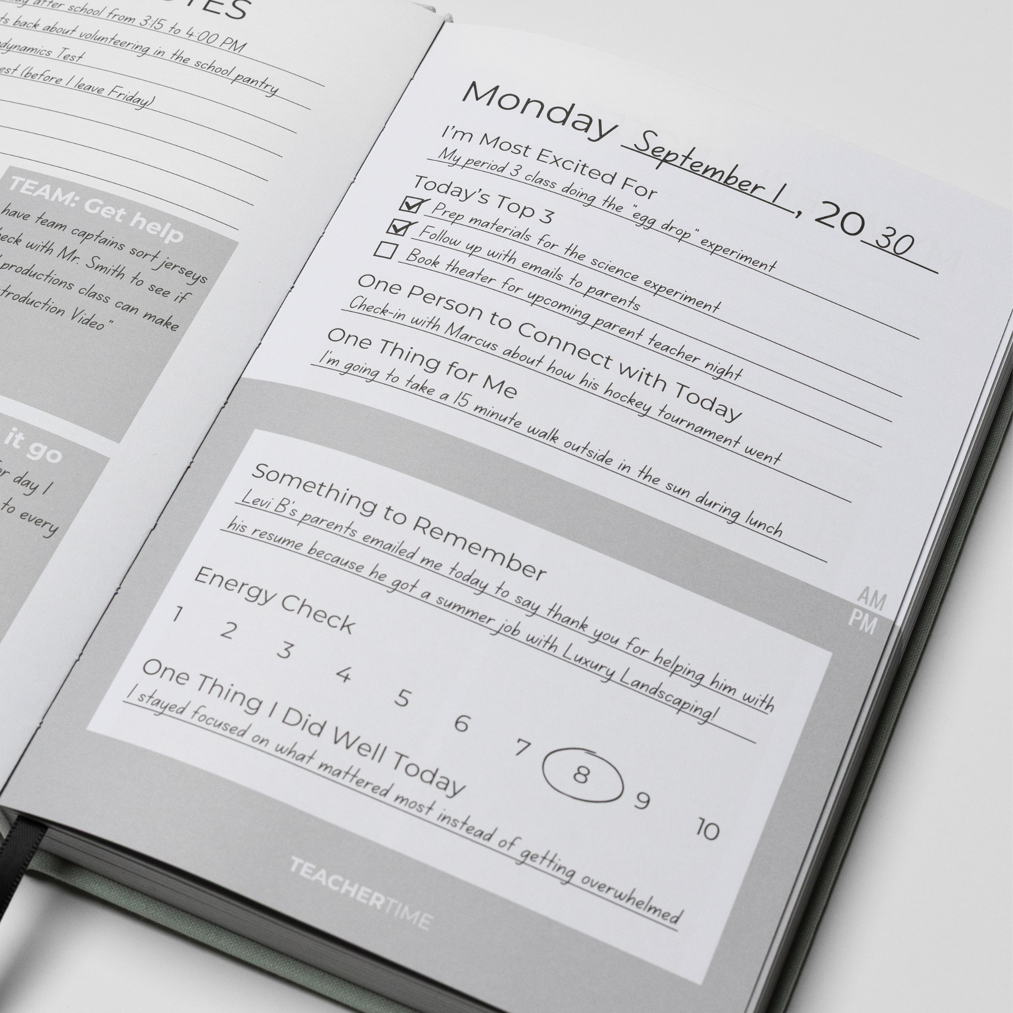 An open TeacherTime daily planner showing a Monday schedule page with lined writing sections, checkboxes, and a 'Something to Remember' box, photographed on a white background.