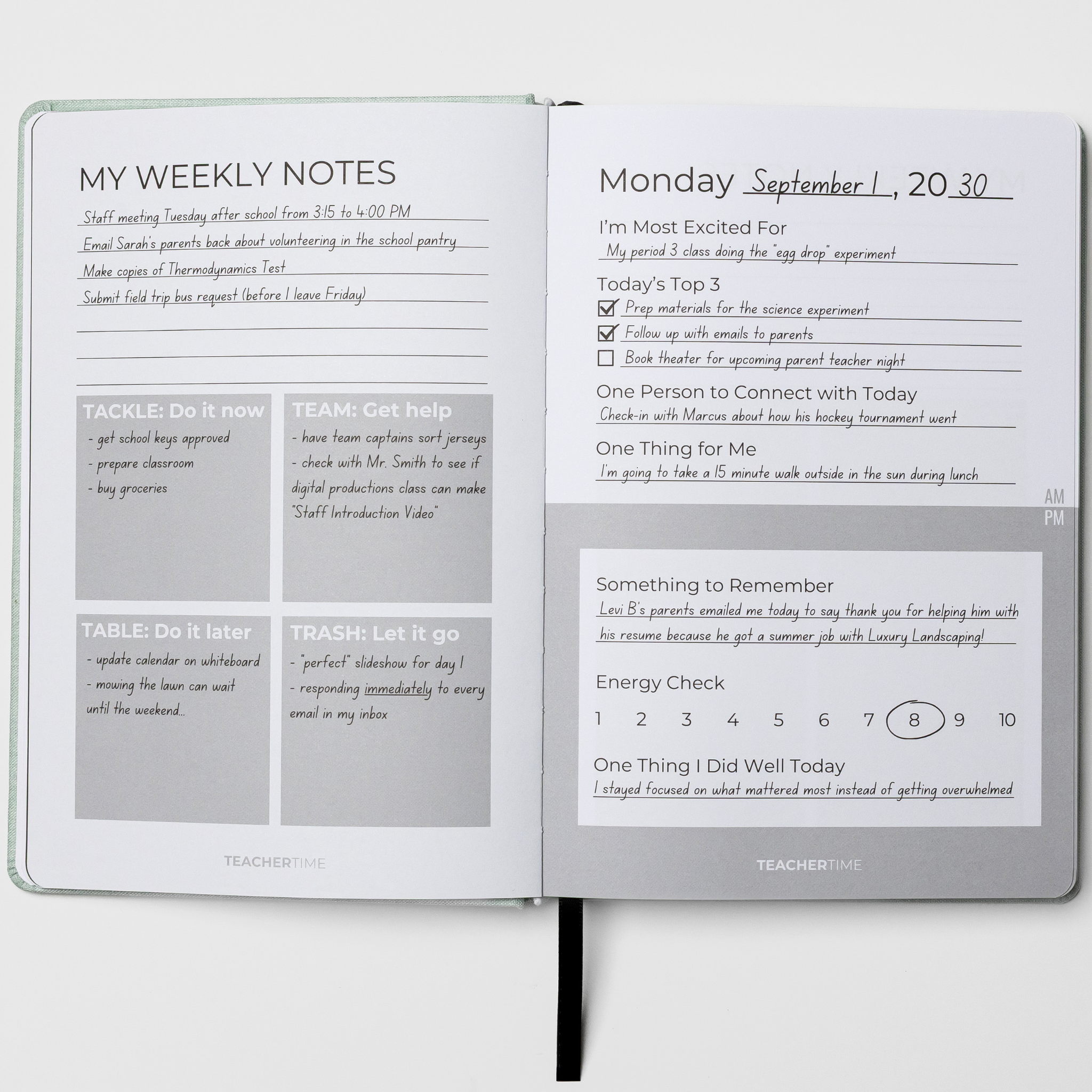 An open planner showing two white pages with handwritten and printed notes, including a weekly notes section, a calendar grid, and a reminder box. The cover has a subtle gray pattern and the brand name TEACHERLINE is printed at the bottom of both pages.