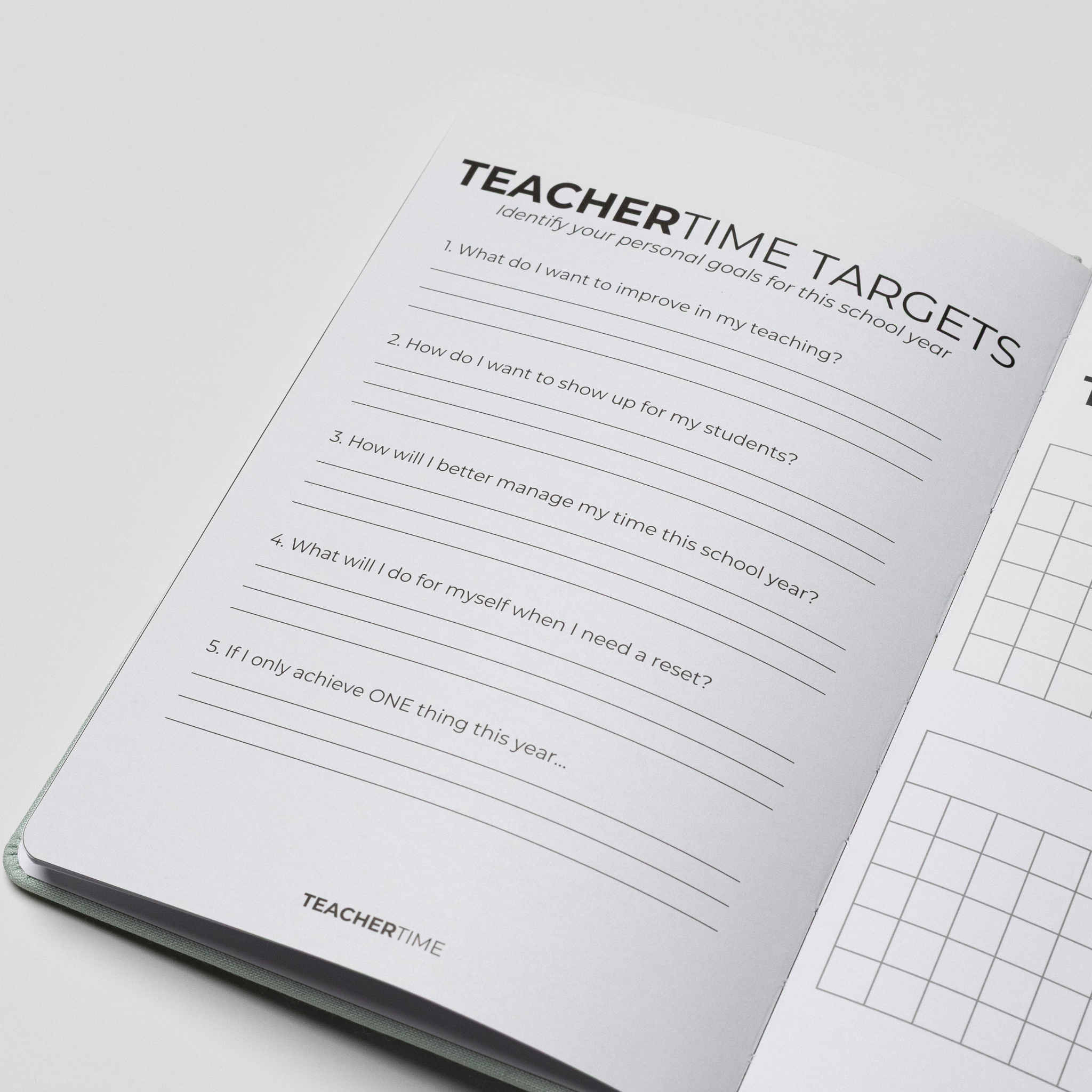 An open TeacherTime journal or planner on a light gray background, showing a printed page titled 'TEACHERTIME TARGETS' with reflective prompts for teachers and part of a grid chart on the next page.